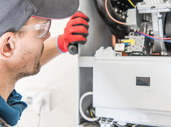 man fixing bolier