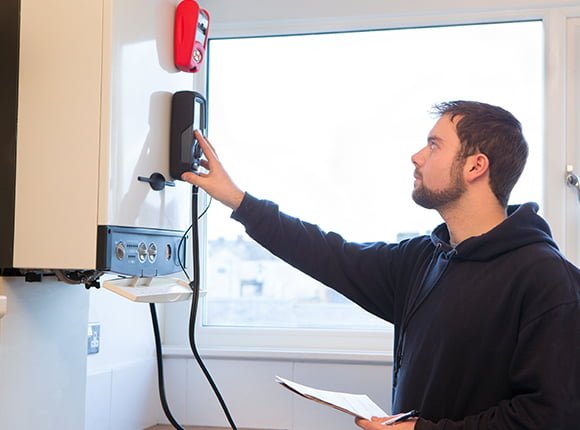 Man checking boiler